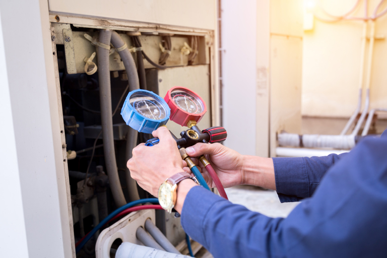 Boiler repair specialist working on a NYC building heating system